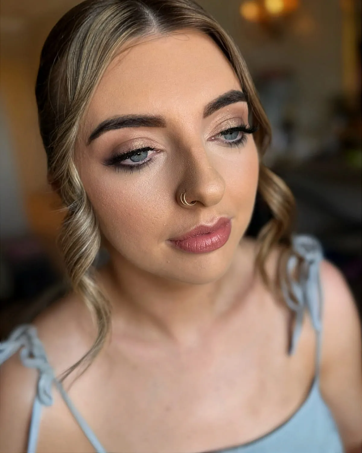 Occasion makeup with a soft bronze eye and fresh dewy base
