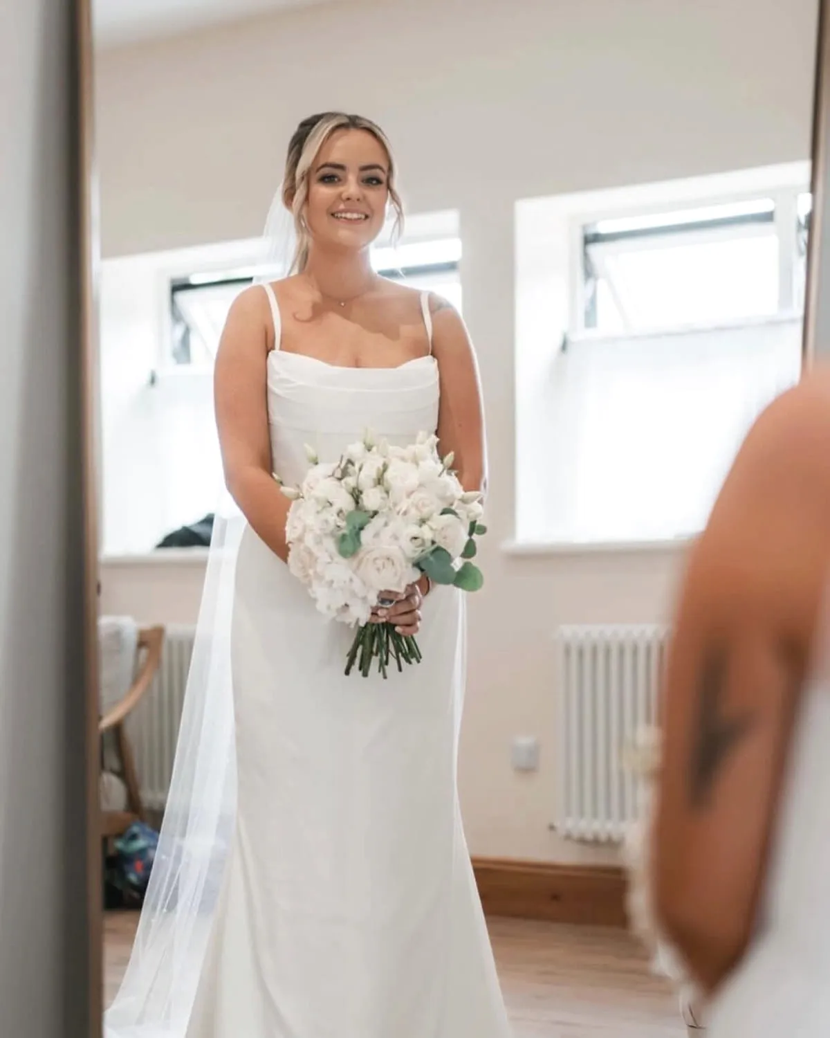 Bride in her dress and veil before the ceremony