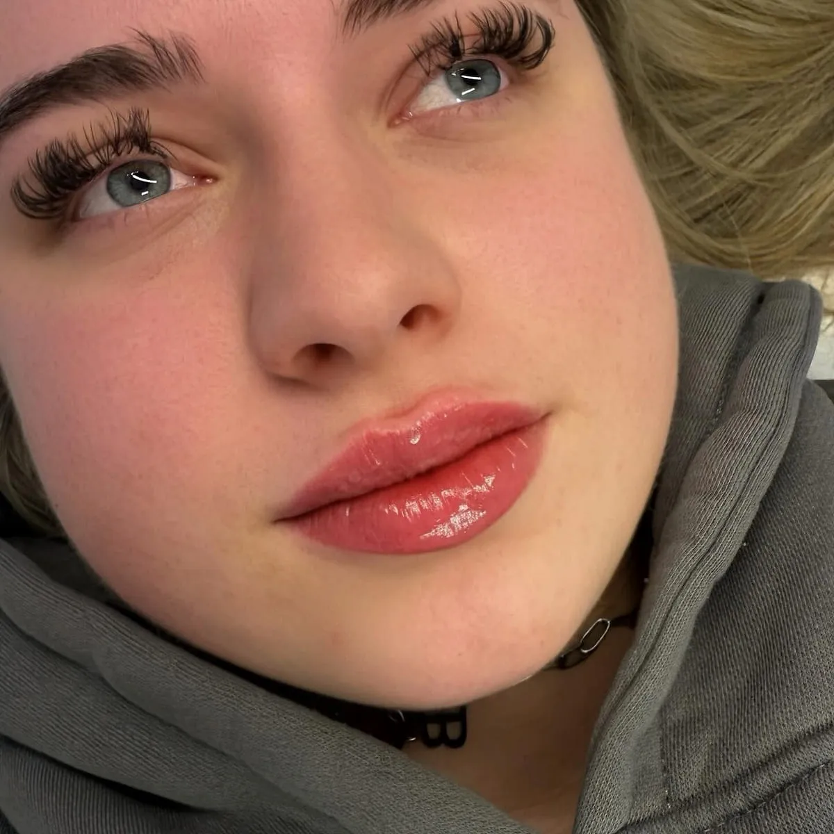 Close detail of the eye area showing lash and brow definition